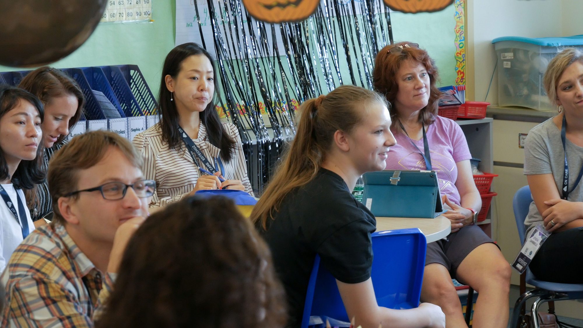 Teachers seated together listening during the workshop