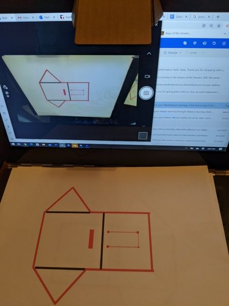 Laptop screen and paper template used to align reflector shapes