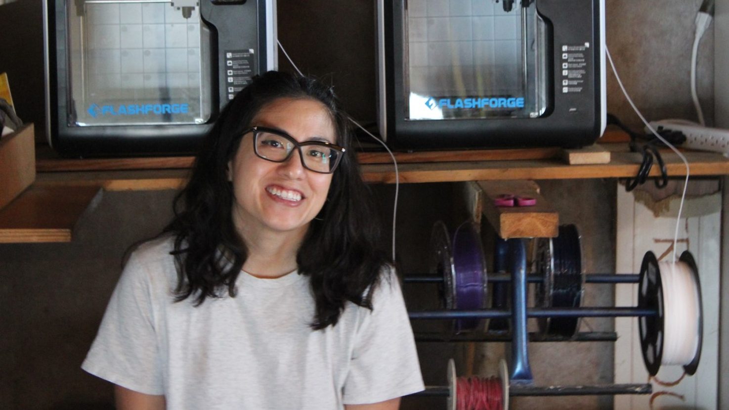 Christy Wang in a makerspace with 3D printers