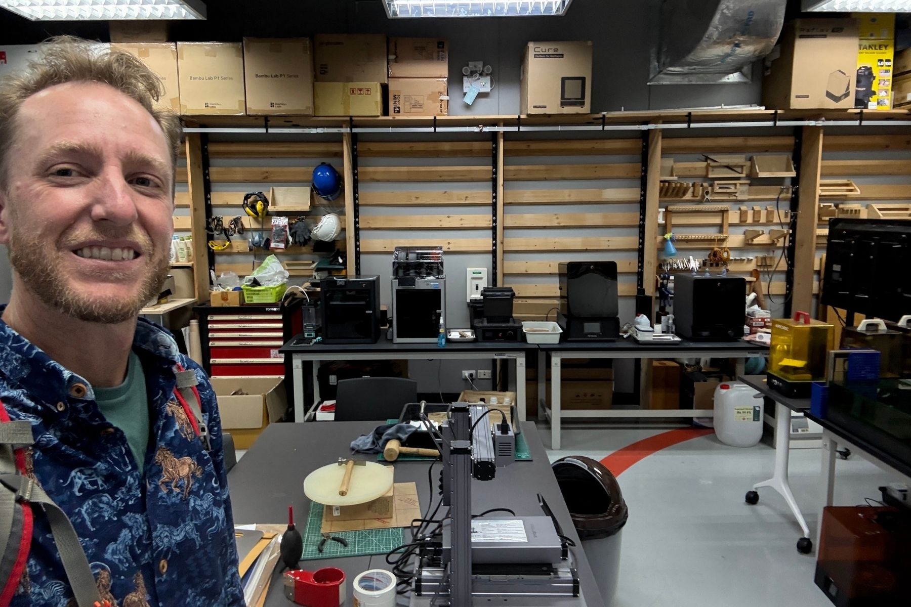 Selfie inside FabLab Bangkok's workshop lined with 3D printers